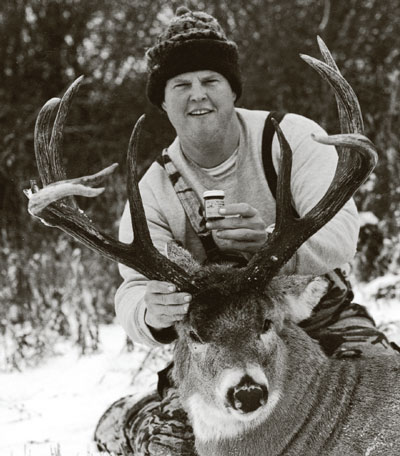 John Collins posing with a 9-point buck